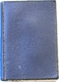 a blue leather book on a black background