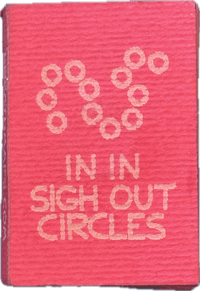 a pink book with the words in sign out circles on it